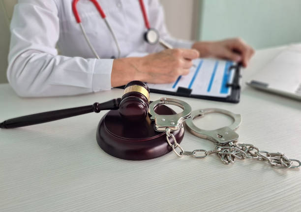 Handcuffs on gavel in medical office